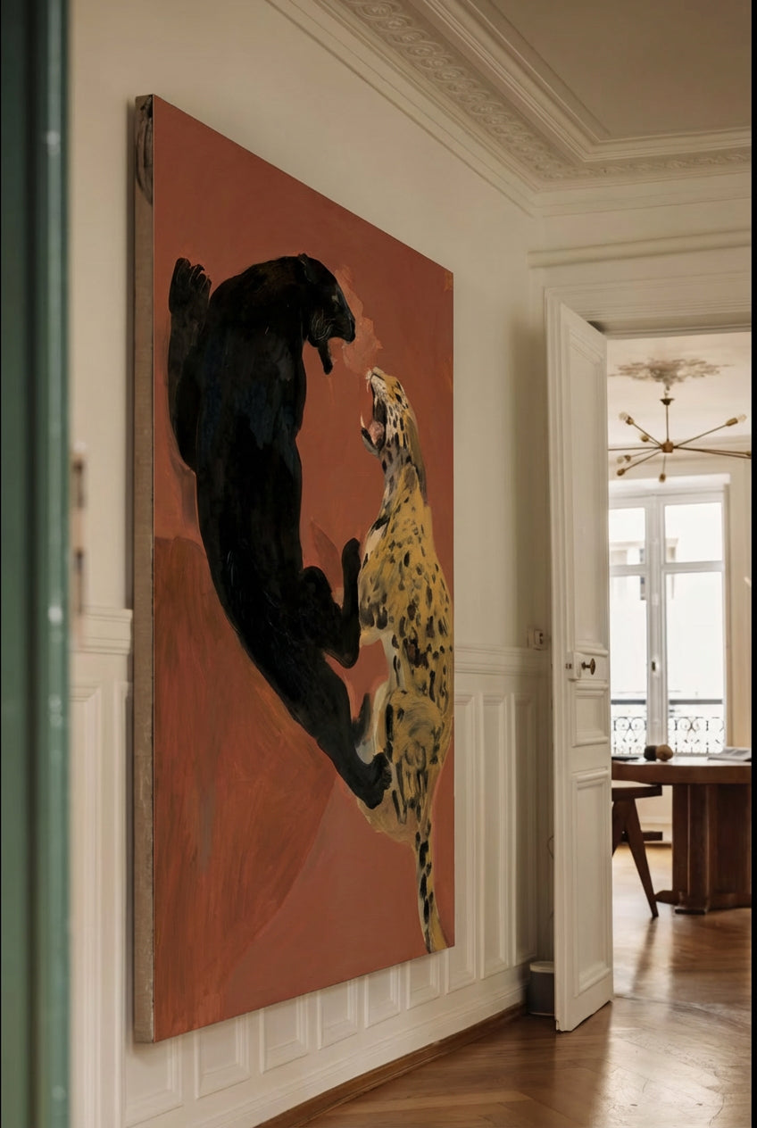 Large painting of two leopards on a wall in a room with a dining area. Clash – Dynamic Abstract Canvas Print | Large Modern Wall Art | Brume Art