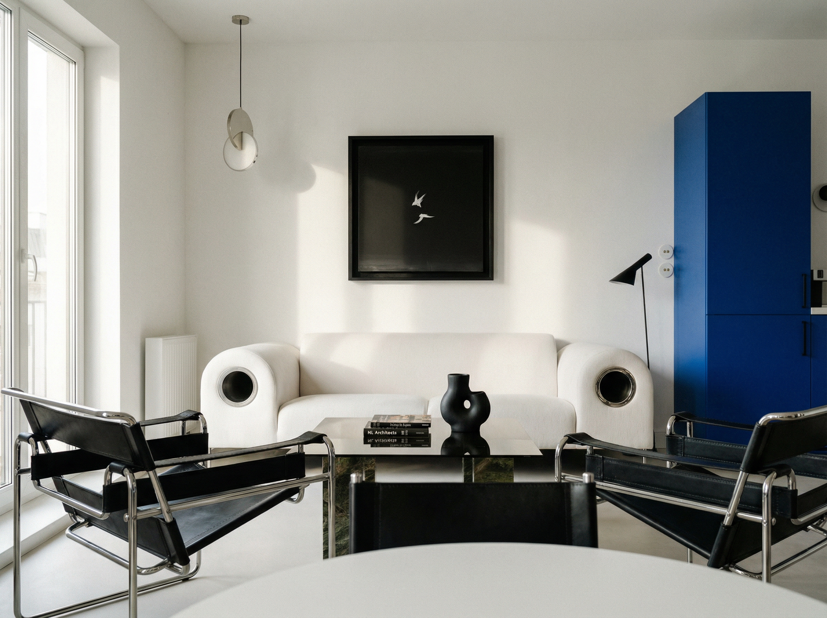 Modern living room with white sofa, black coffee table, and blue cabinet. Bird 2 – Elegant Nature Canvas Print | Luxury Wall Art | Brume Art