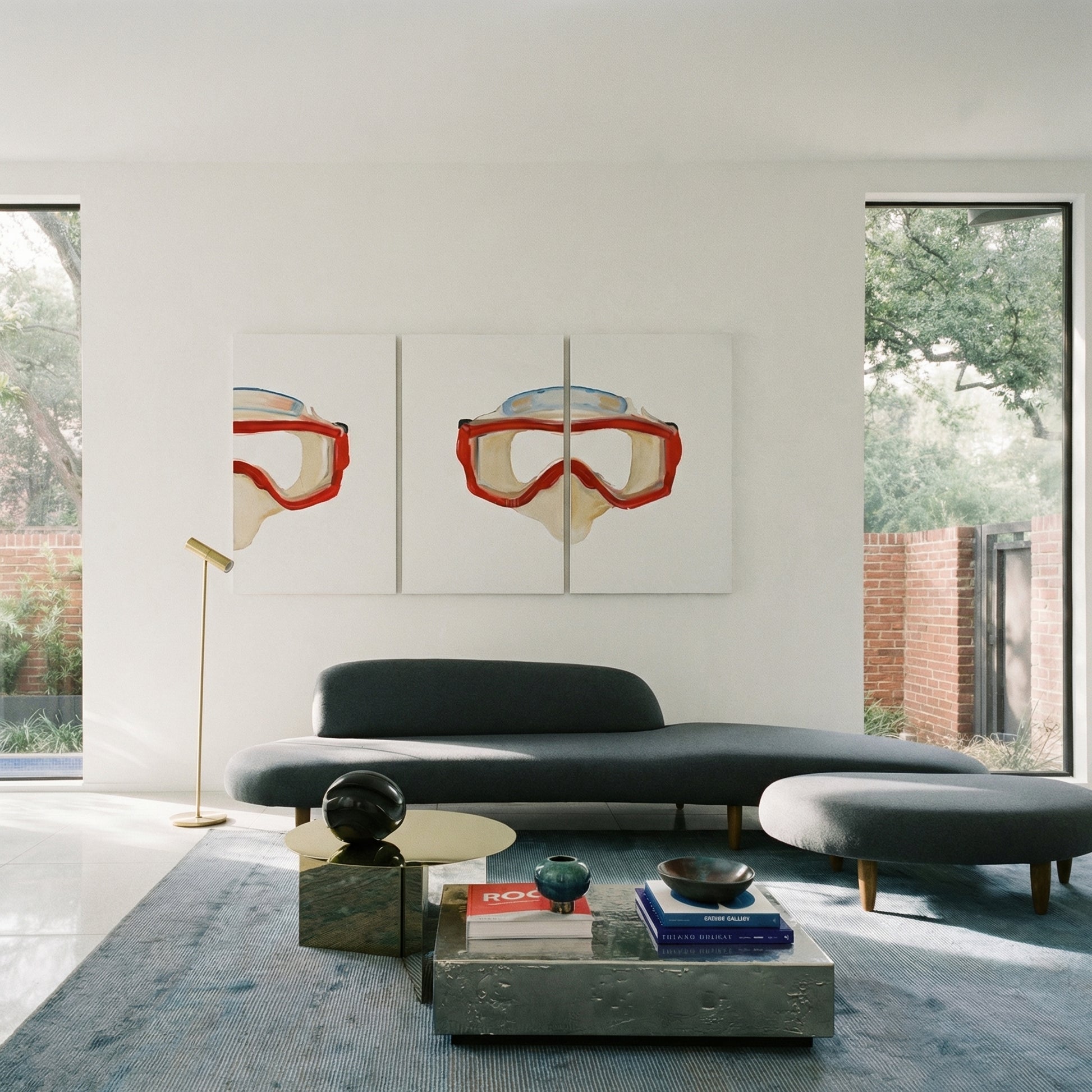 Modern living room with a gray sofa, coffee table, and wall art of goggles. Diving Mask – Unique Figurative Canvas Art | Premium Wall Decor | Brume Art