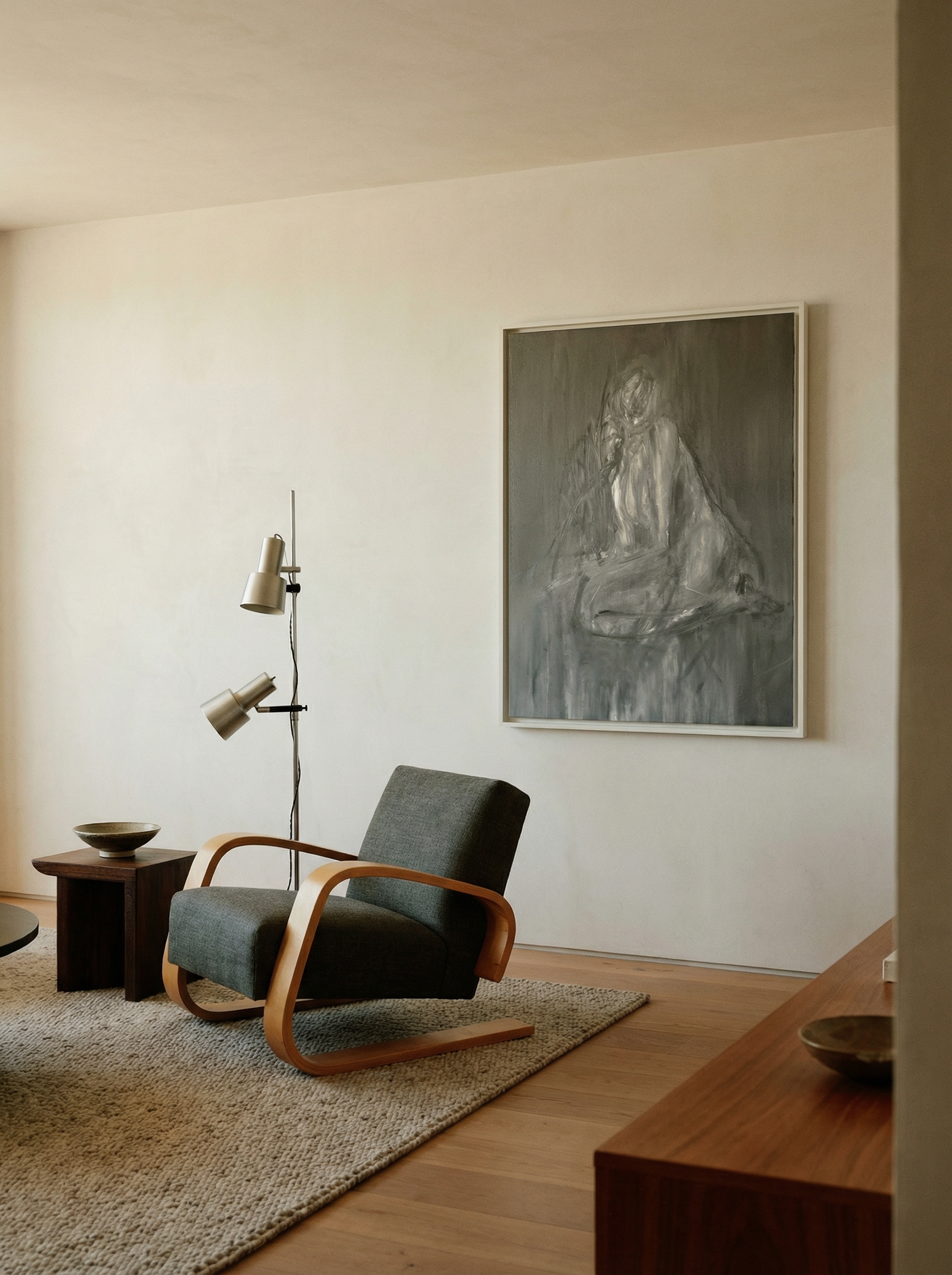 Modern living room with a gray armchair, side table, and artwork on the wall. Still 2 – Serene Abstract Canvas Print | Premium Luxury Wall Art | Brume Art