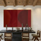 Dining room with a dark wooden table, chairs, and a large red abstract painting on the wall. Eclipse – Contemporary Abstract Canvas | Oversized Luxury Wall Art | Brume Art