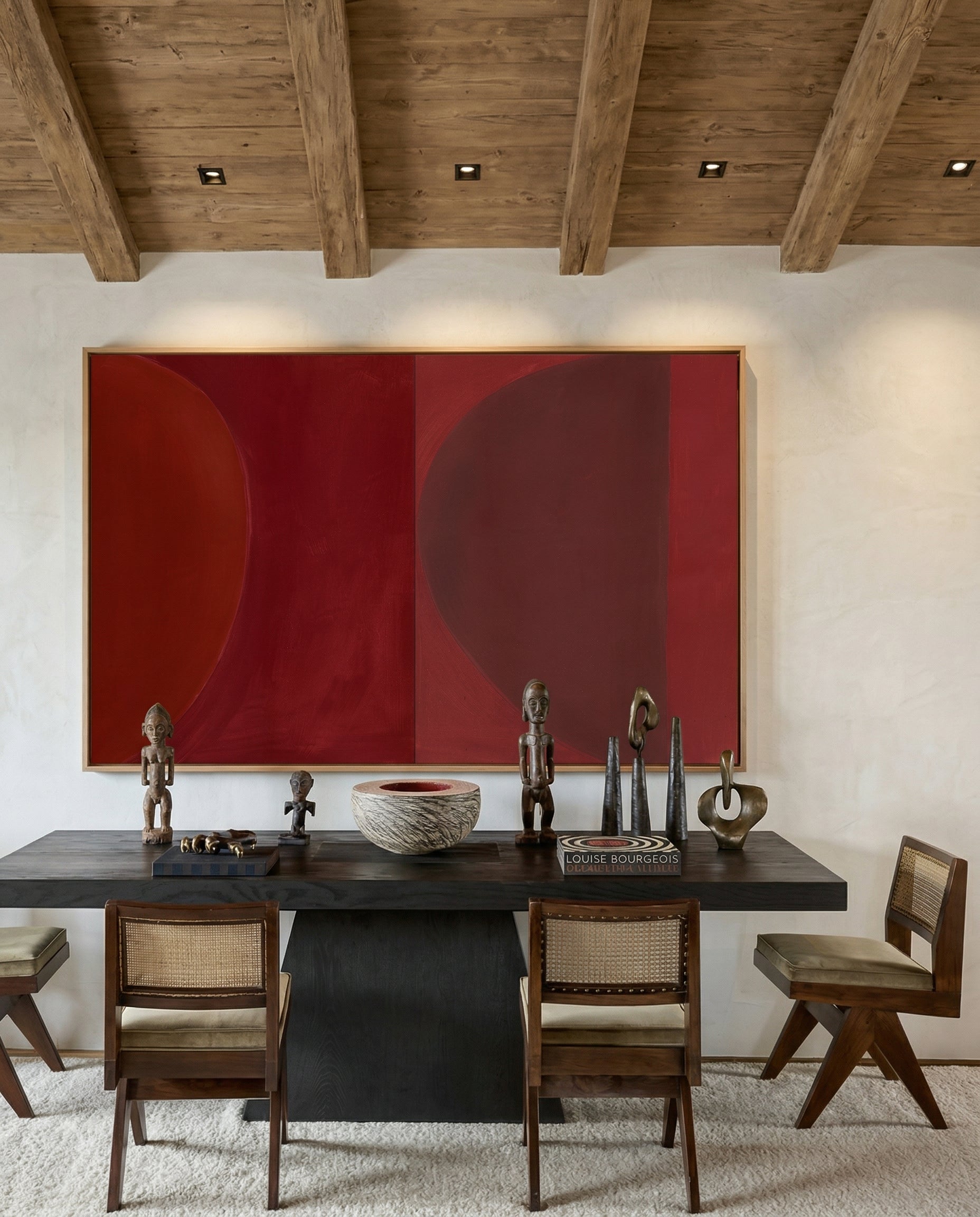 Dining room with a dark wooden table, chairs, and a large red abstract painting on the wall. Eclipse – Contemporary Abstract Canvas | Oversized Luxury Wall Art | Brume Art
