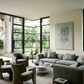 Modern living room with gray sofa, chairs, and a large window view. tension 3 – Textured Abstract Canvas Art | Premium Luxury Wall Decor | Brume Art