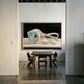 Modern interior with a dining table and chairs, featuring a large abstract painting on the wall. Goggles – Unique Figurative Canvas Art | Premium Wall Decor | Brume Art