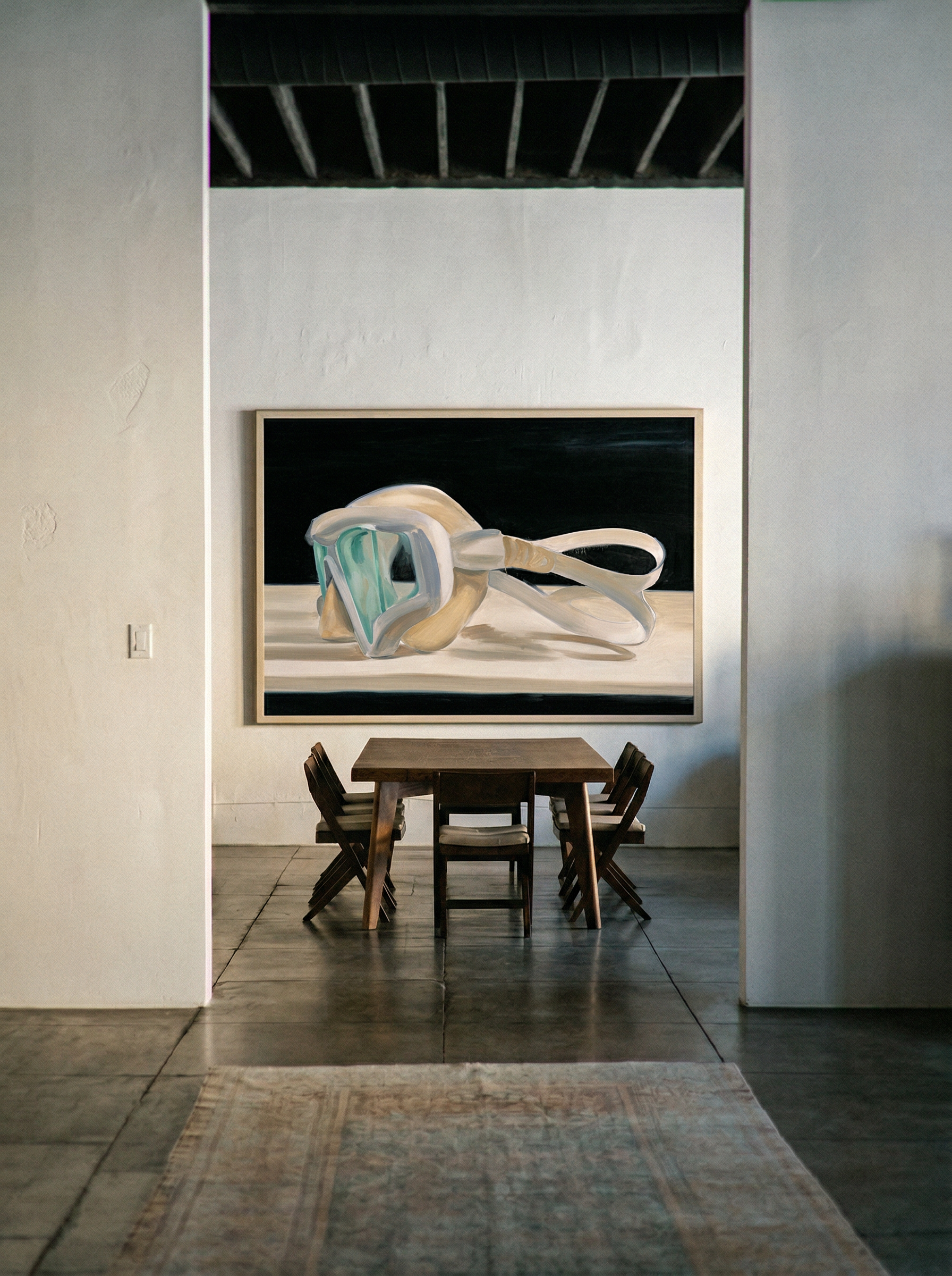 Modern interior with a dining table and chairs, featuring a large abstract painting on the wall. Goggles – Unique Figurative Canvas Art | Premium Wall Decor | Brume Art