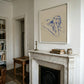 Living room with marble fireplace, artwork above, and books on a shelf. Presence 3 – Figurative Abstract Canvas | Premium Wall Art | Brume Art | Luxury Wall Decor | Large Canvas Wall Art | Oversized Wall Hanging-Brume art
