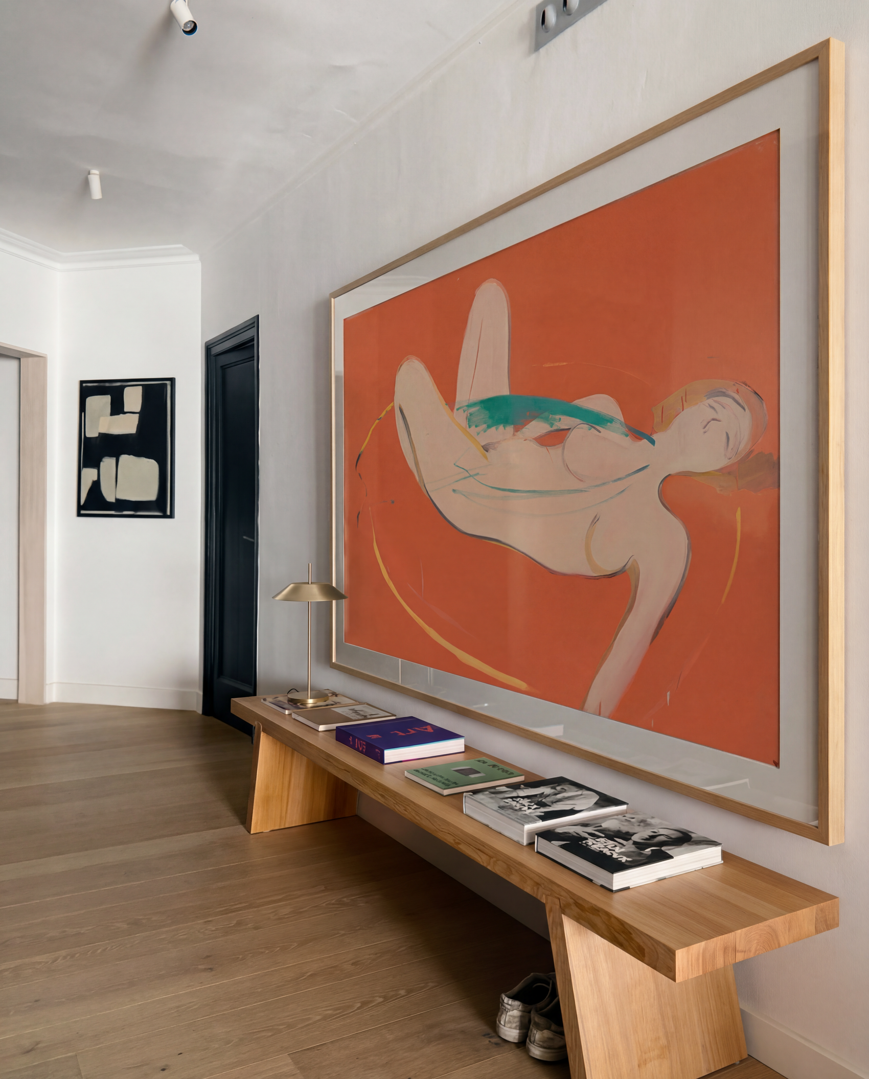 Modern interior with a large abstract painting on the wall and a wooden bench below it. Envelope in Orange – Warm Abstract Canvas Art | Luxury Wall Decor | Brume Art