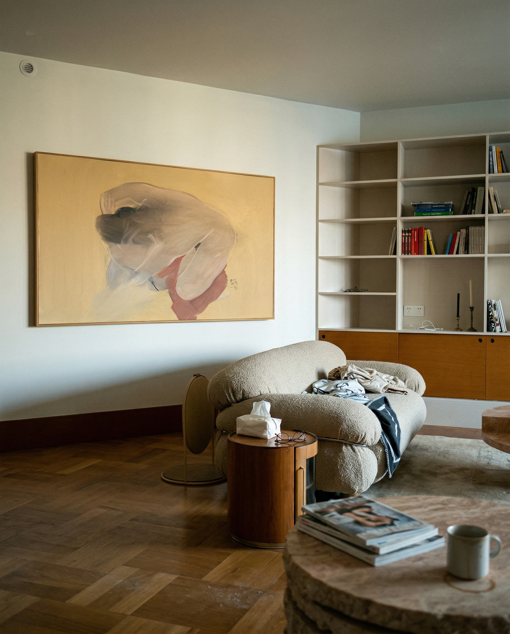 Living room with a beige armchair, coffee table, and bookshelf. Soft Body – Figurative Abstract Canvas Print | Premium Wall Art | Brume Art