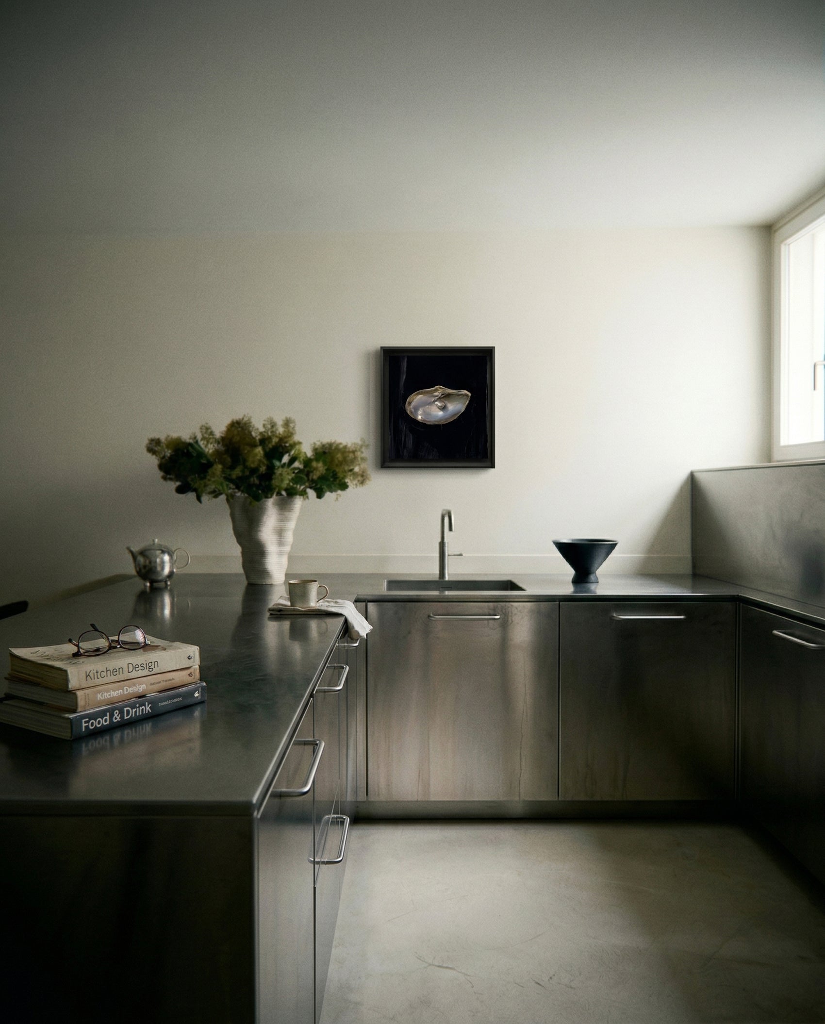 Modern kitchen with stainless steel appliances and a vase of flowers on the counter. Pearl – Elegant Abstract Canvas Wall Art | Luxury Giclée Print | Brume Art