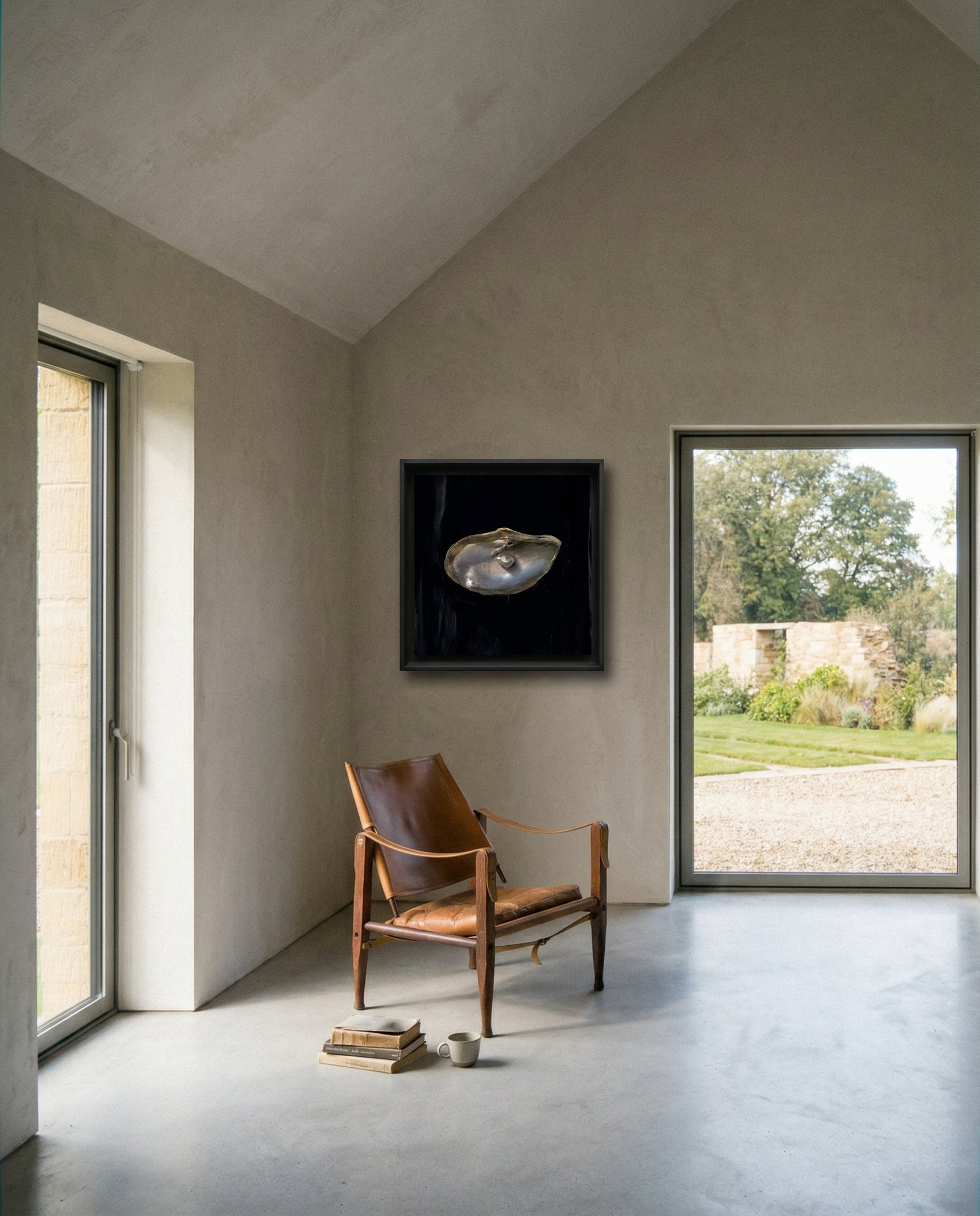 Modern interior with a brown leather chair, framed artwork, and large windows. Pearl – Elegant Abstract Canvas Wall Art | Luxury Giclée Print | Brume Art