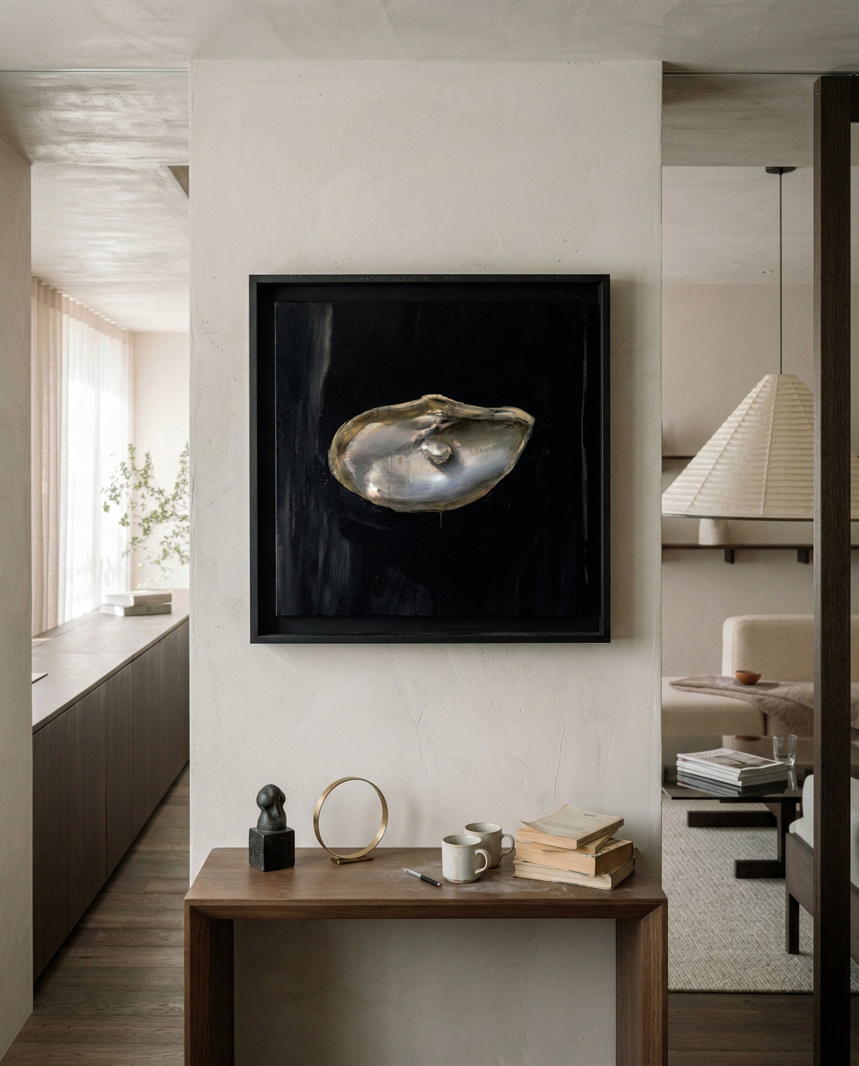 Framed artwork of an oyster shell on a wall in a modern interior setting. Pearl – Elegant Abstract Canvas Wall Art | Luxury Giclée Print | Brume Art