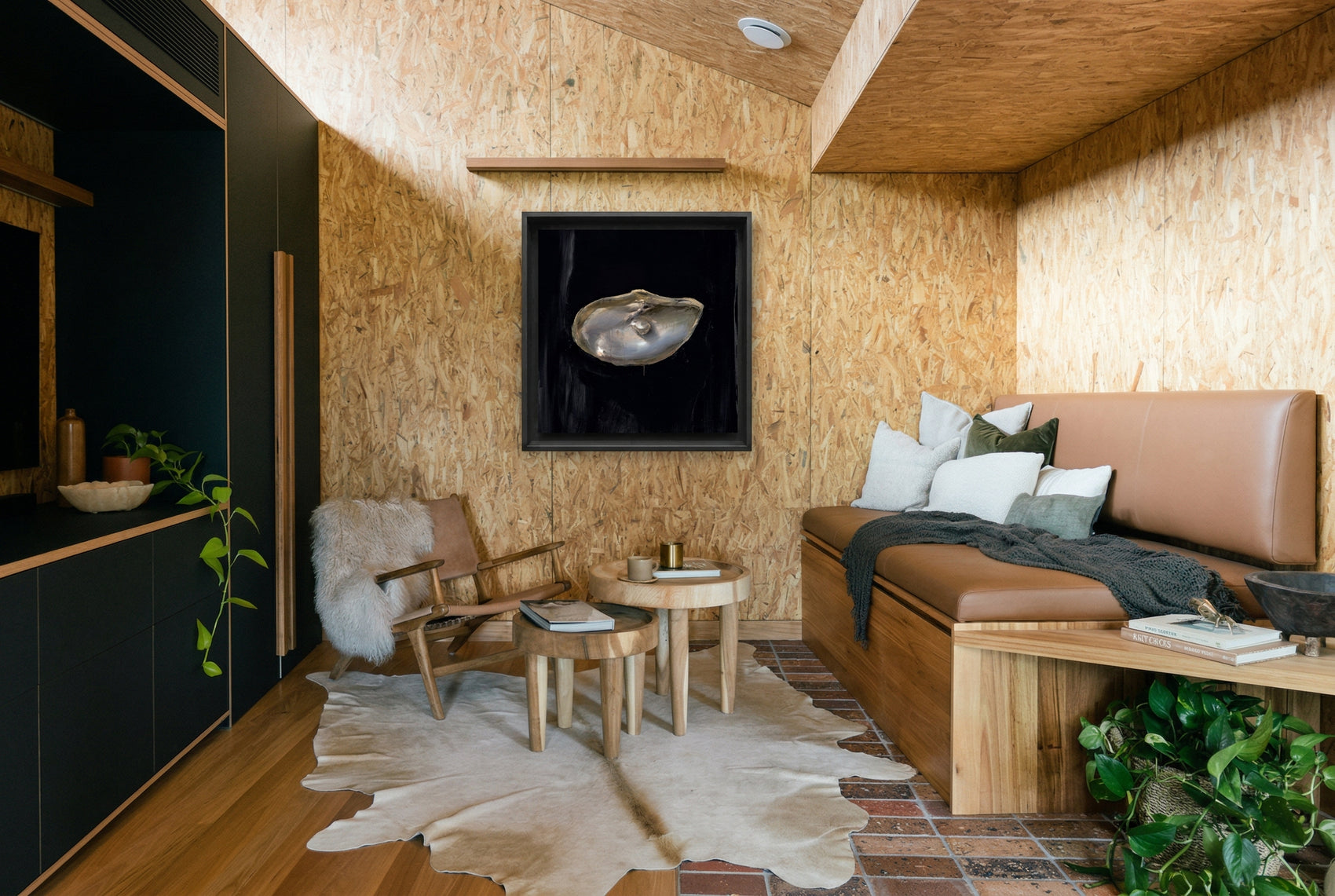 Modern living room with wooden walls, brown sofa, and decorative items. Pearl – Elegant Abstract Canvas Wall Art | Luxury Giclée Print | Brume Art