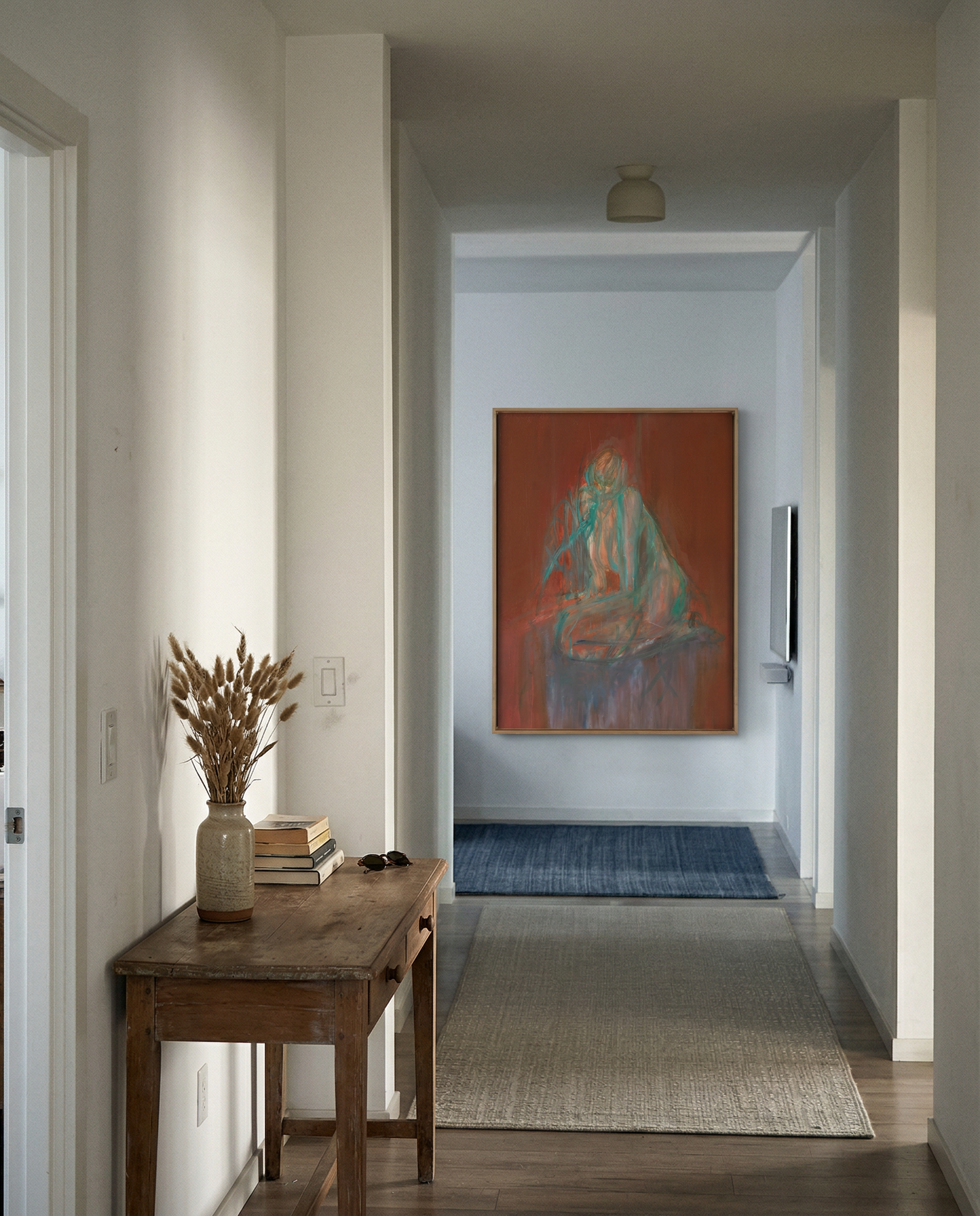 Hallway with a wooden side table, vase with dried plants, and a colorful abstract painting on the wall. Still – Minimalist Abstract Canvas Art | Large Luxury Wall Decor | Brume Art