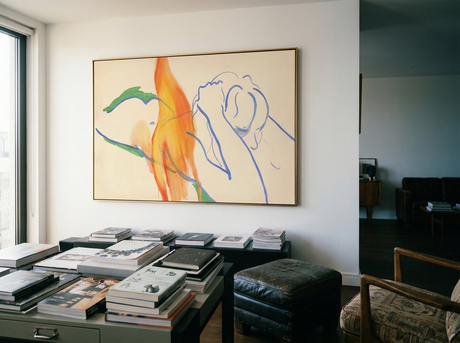 Abstract artwork on a wall above a table with books in a room. Figure and Flame – Figurative Canvas Wall Art | Premium Luxury Print | Brume Art
