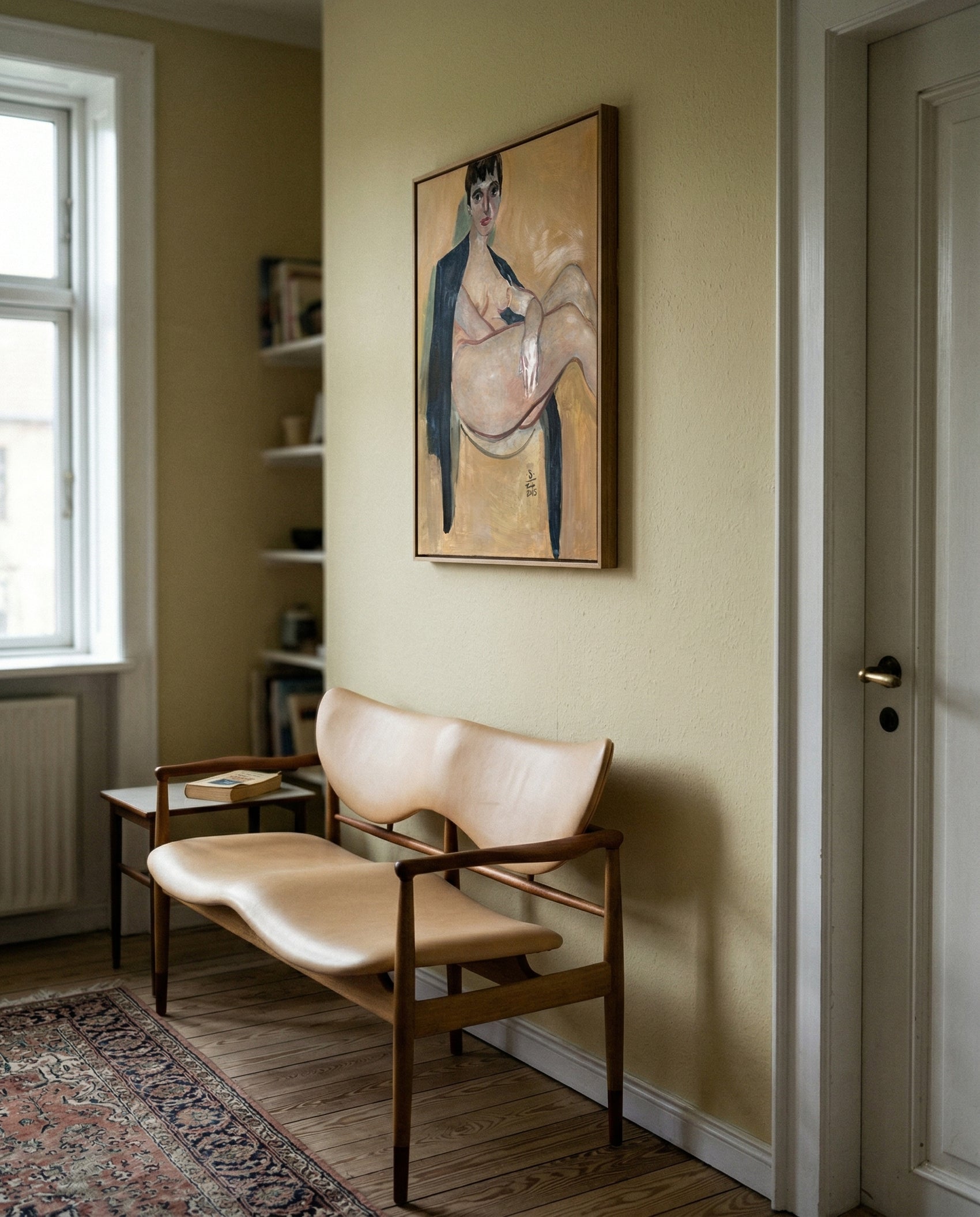 Beige chair in a room with a painting on the wall Girl with Short Hair – Portrait Canvas Art | Luxury Wall Decor | Brume Art