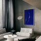 Modern living room with a blue abstract painting on the wall. Strike – Bold Abstract Canvas Wall Art | Large Luxury Print | Brume Art