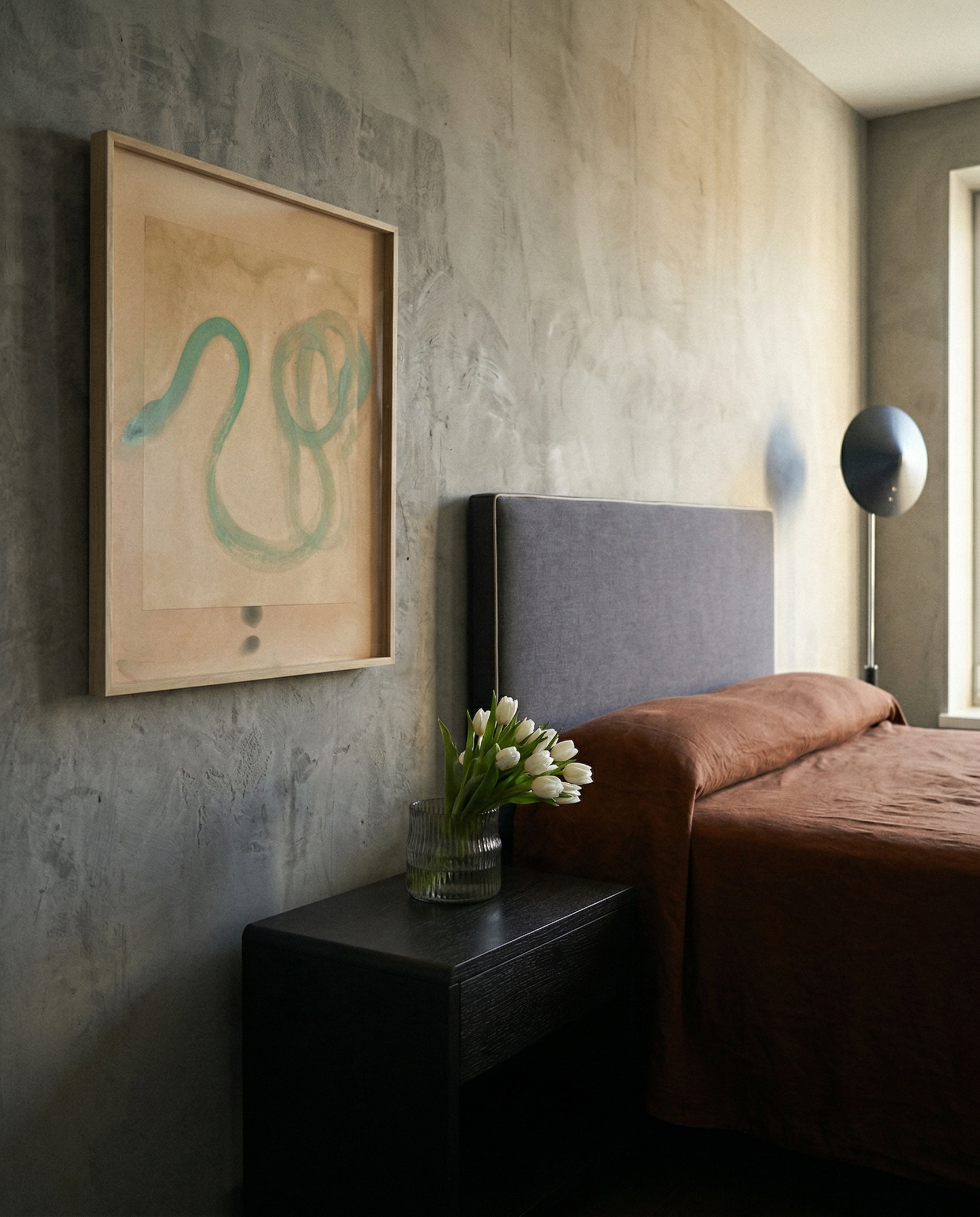 Modern bedroom with abstract art on the wall, a bed, and a vase with flowers. Green Snake 2 – Nature Canvas Wall Art | Premium Luxury Print | Brume Art