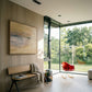 Modern interior with a bench, abstract painting, and red chair near large windows. Field Yellow – Landscape Canvas Wall Art | Large Luxury Print | Brume Art