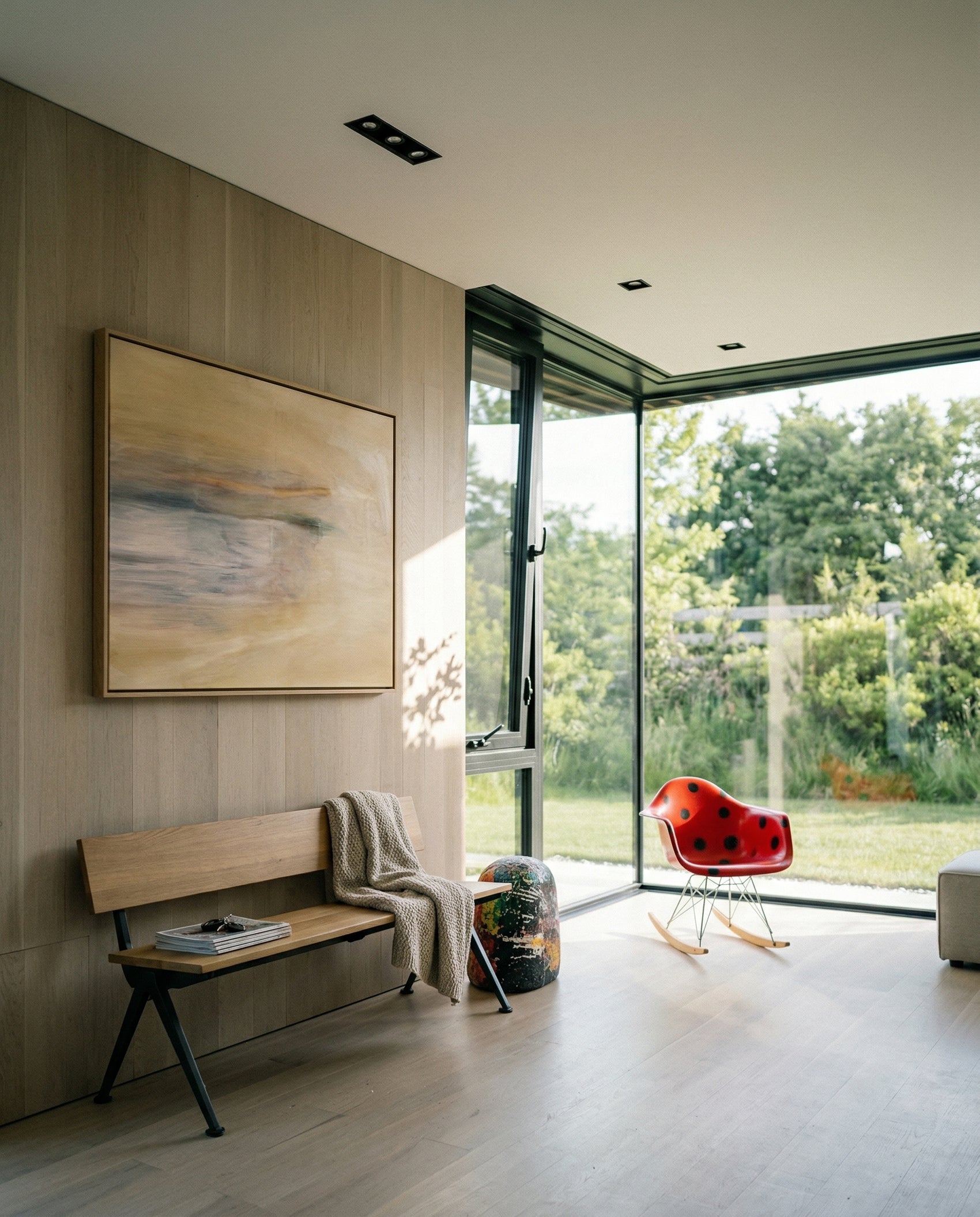 Modern interior with a bench, abstract painting, and red chair near large windows. Field Yellow – Landscape Canvas Wall Art | Large Luxury Print | Brume Art