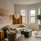 Modern living room with beige sofa, armchair, and abstract painting. Field Yellow – Landscape Canvas Wall Art | Large Luxury Print | Brume Art