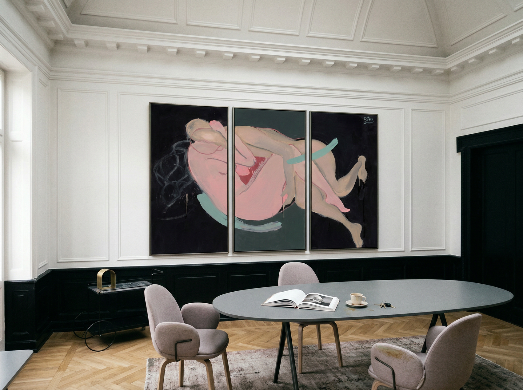 Modern interior with abstract artwork on a wall above a round table. Embrace – Figurative Canvas Wall Art | Oversized Luxury Print | Brume Art