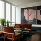 Living room with brown furniture, a coffee table, and large abstract paintings on the wall. Embrace – Figurative Canvas Wall Art | Oversized Luxury Print | Brume Art
