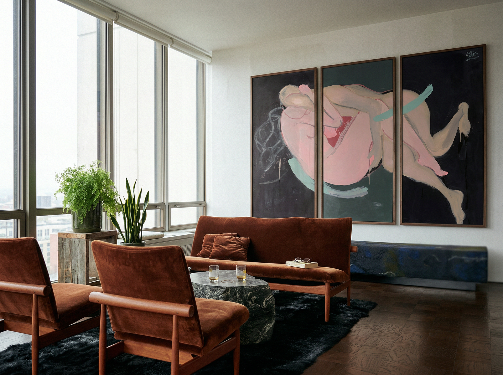 Living room with brown furniture, a coffee table, and large abstract paintings on the wall. Embrace – Figurative Canvas Wall Art | Oversized Luxury Print | Brume Art