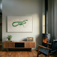 Living room with a wooden cabinet, chair, and wall art. Green Snake – Nature Canvas Wall Art | Large Luxury Print | Brume Art