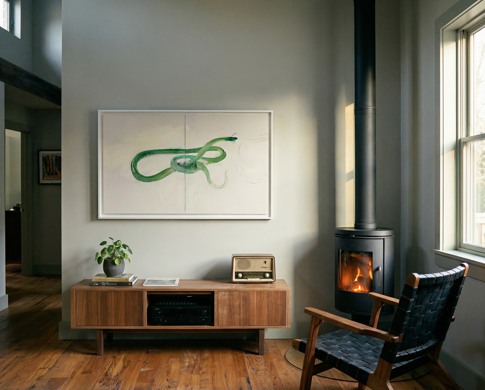 Living room with a wooden cabinet, chair, and wall art. Green Snake – Nature Canvas Wall Art | Large Luxury Print | Brume Art