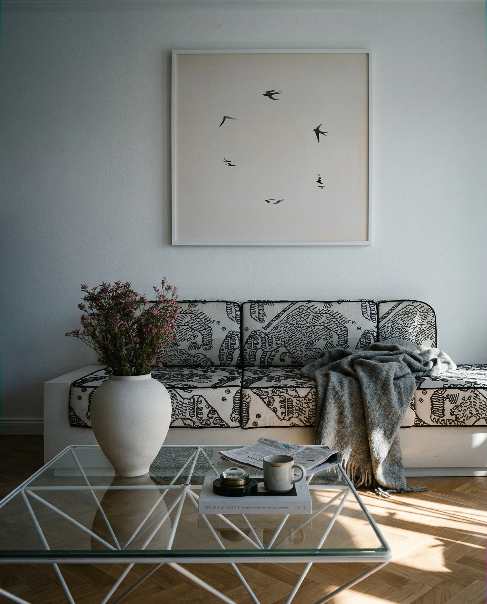 Living room with a sofa, coffee table, and wall art Birds – Nature Canvas Wall Art | Large Luxury Print | Brume Art