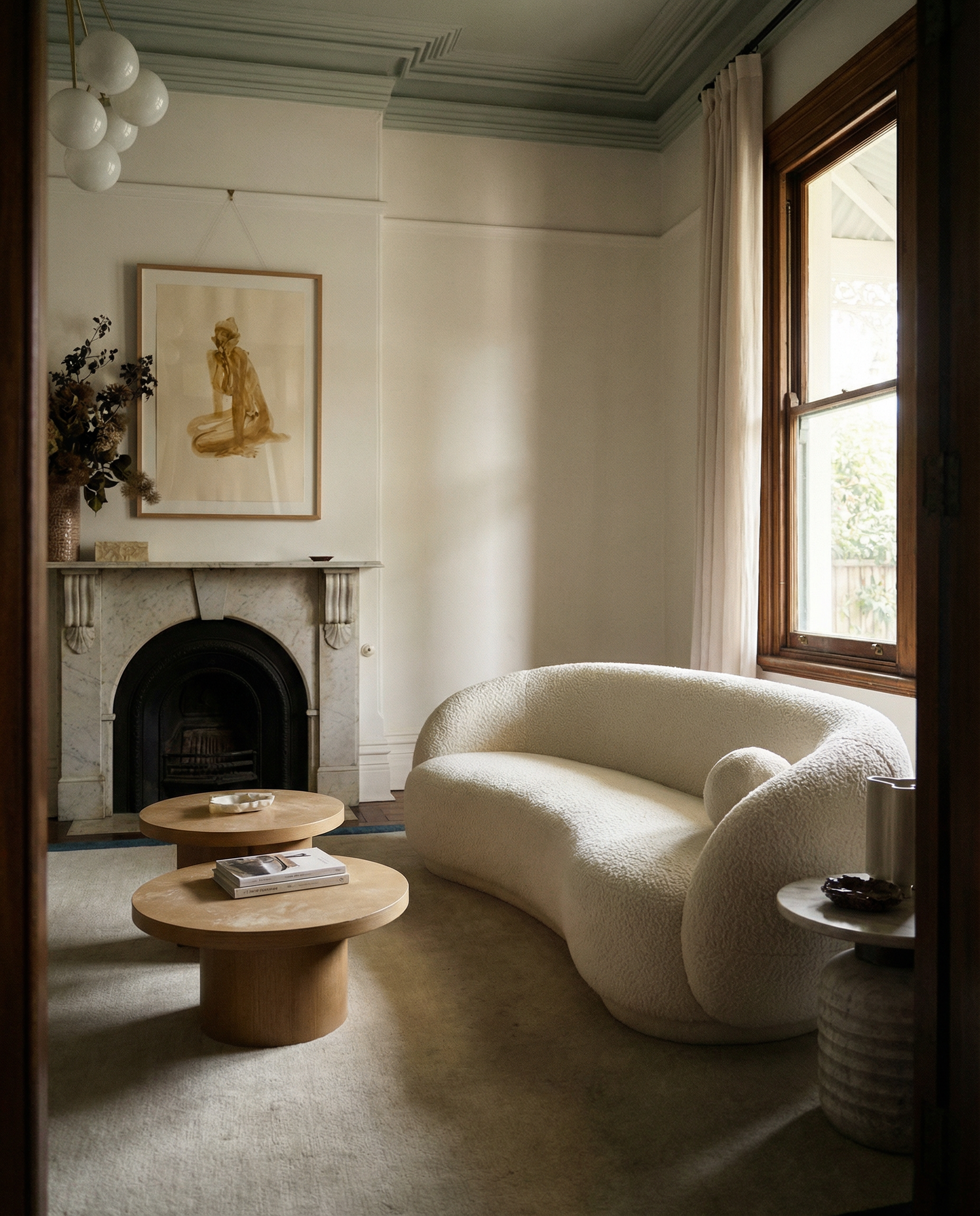 Modern living room with a white textured sofa, wooden coffee tables, and a fireplace. Still 3 – Serene Abstract Canvas Print | Premium Luxury Wall Art | Brume Art