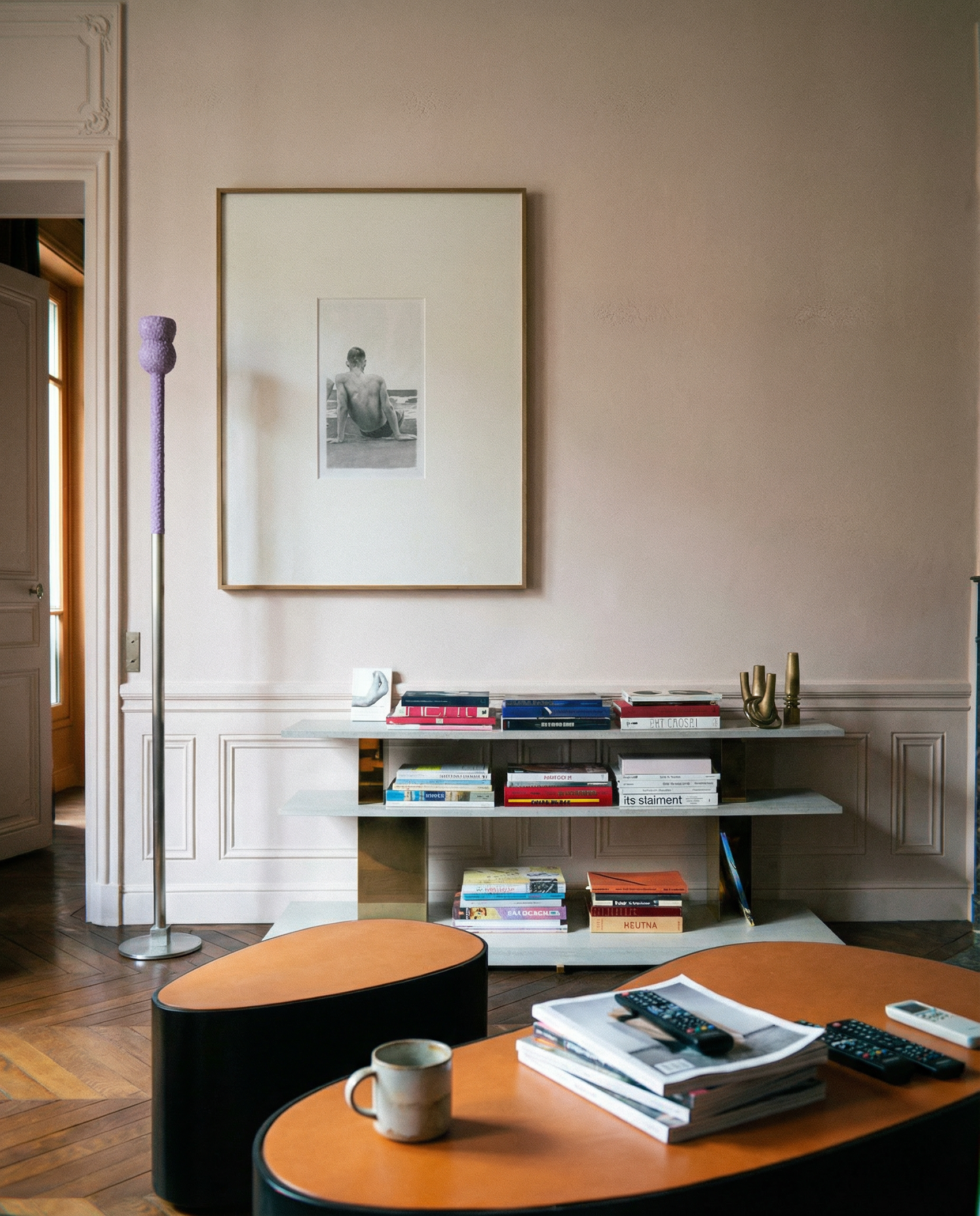 Modern living room with a bookshelf, table, and decor items. Seaside retreat Contemporary Sketch Canvas Art | Luxury Wall Decor | Brume Art|