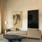 Modern living room with a beige sofa, black coffee table, and wall art of a tiger. Tiger – Contemporary Animal Canvas Art | Luxury Wall Decor | Brume Art