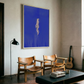 Modern living room with wooden chairs, a coffee table, and a large blue abstract painting on the wall. in the blue – Figurative Canvas Print | Modern Luxury Wall Art | Brume Art