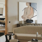 Modern living room with beige sofa, black chairs, and a large abstract painting on the wall. Held body – Figurative Canvas Wall Art | Contemporary Luxury Print | Brume Art