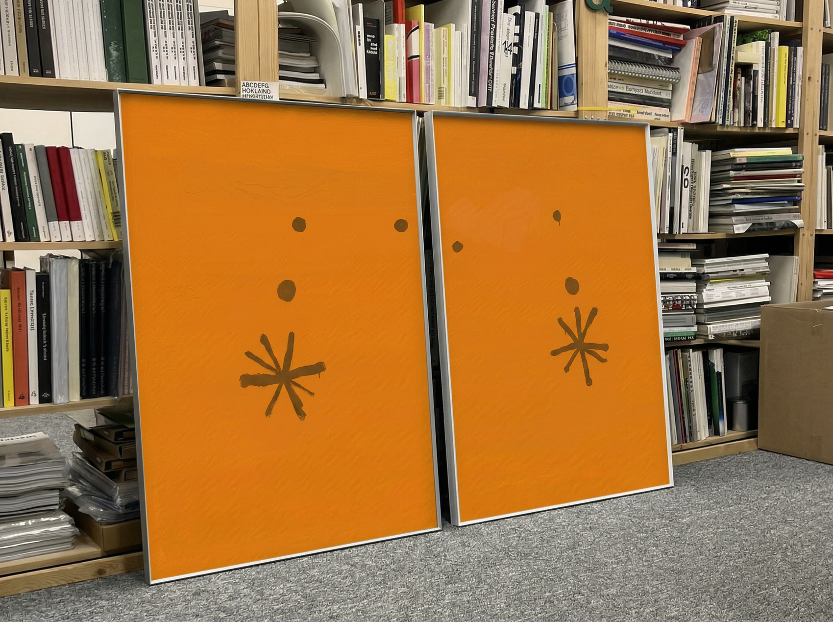 Two orange books with star designs on a bookshelf. Marks – Bold Abstract Canvas Wall Art | Premium Luxury Print | Brume Art
