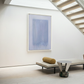 Modern interior with abstract art, bench, and decorative items on a light wood floor. Frame – Bold Abstract Canvas Wall Art | Large Luxury Print | Brume Art