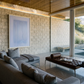 Modern living room with gray sofa, wooden coffee table, and large windows. Frame – Bold Abstract Canvas Wall Art | Large Luxury Print | Brume Art