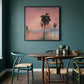 Dining room with a wooden table and chairs against a teal wall with a framed artwork of palm trees. Palm tree – Landscape Canvas Wall Art | Large Luxury Print | Brume Art 