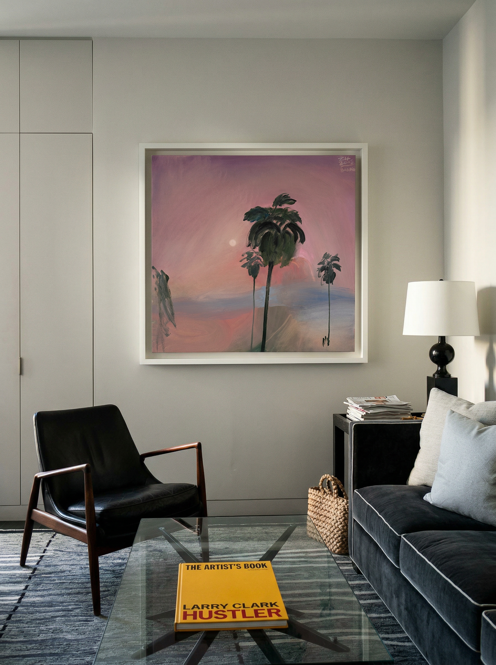 Modern living room with a painting of palm trees on the wall, a black chair, and a gray sofa. Palm tree – Landscape Canvas Wall Art | Large Luxury Print | Brume Art 