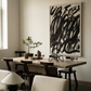 Dining room with a wooden table, chairs, and a large abstract painting on the wall. Noise 2 – Textured Abstract Canvas Art | Premium Luxury Wall Decor | Brume Art