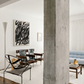 Modern living room with concrete pillar, abstract art, and stylish furniture. Noise 2 – Textured Abstract Canvas Art | Premium Luxury Wall Decor | Brume Art