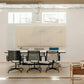 Modern office conference room with a large beige wall-mounted board and chairs around a glass table. Black lines – Bold Abstract Canvas Print | Large Luxury Wall Art