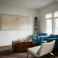 Modern living room with blue sofa, white armchair, and wooden coffee table. Black lines – Bold Abstract Canvas Print | Large Luxury Wall Art