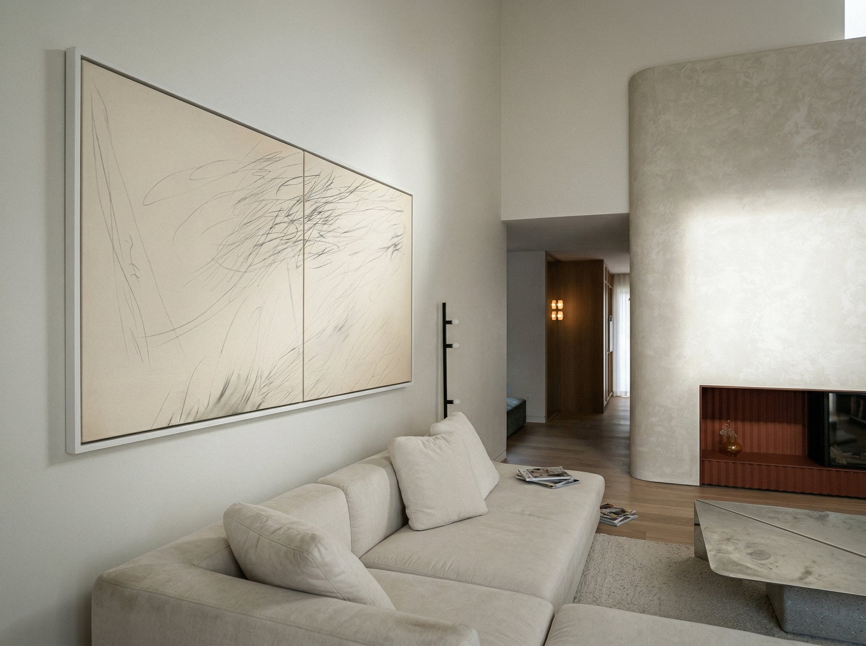 Modern living room with a beige sofa, abstract art, and a fireplace. Black lines – Bold Abstract Canvas Print | Large Luxury Wall Art