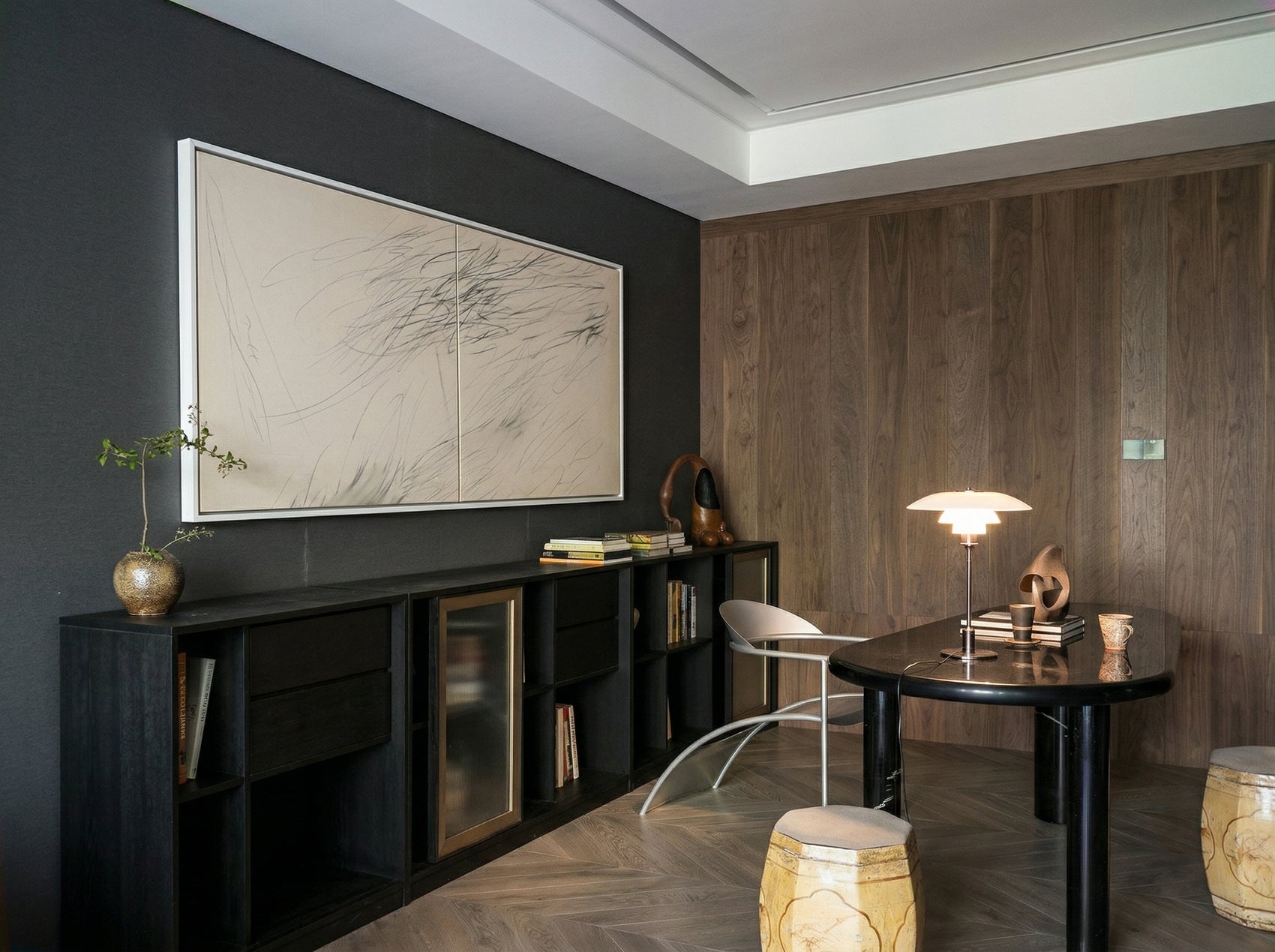 Modern interior design with dark walls, a black table, and decorative items. Black lines – Bold Abstract Canvas Print | Large Luxury Wall Art