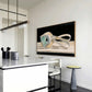 Modern kitchen with a white island, chairs, and a wall-mounted TV displaying abstract art. Goggles – Unique Figurative Canvas Art | Premium Wall Decor | Brume Art