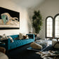 Modern living room with a blue sofa, glass coffee table, and decorative elements. Goggles – Unique Figurative Canvas Art | Premium Wall Decor | Brume Art