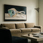 Living room with a beige sofa, coffee table, and abstract painting on the wall. Goggles – Unique Figurative Canvas Art | Premium Wall Decor | Brume Art