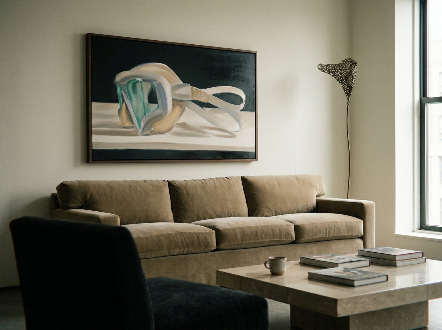 Living room with a beige sofa, coffee table, and abstract painting on the wall. Goggles – Unique Figurative Canvas Art | Premium Wall Decor | Brume Art